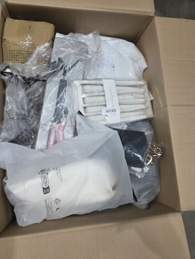 Master carton containing boxed household items, showing home decor packaging and lifestyle accessories.