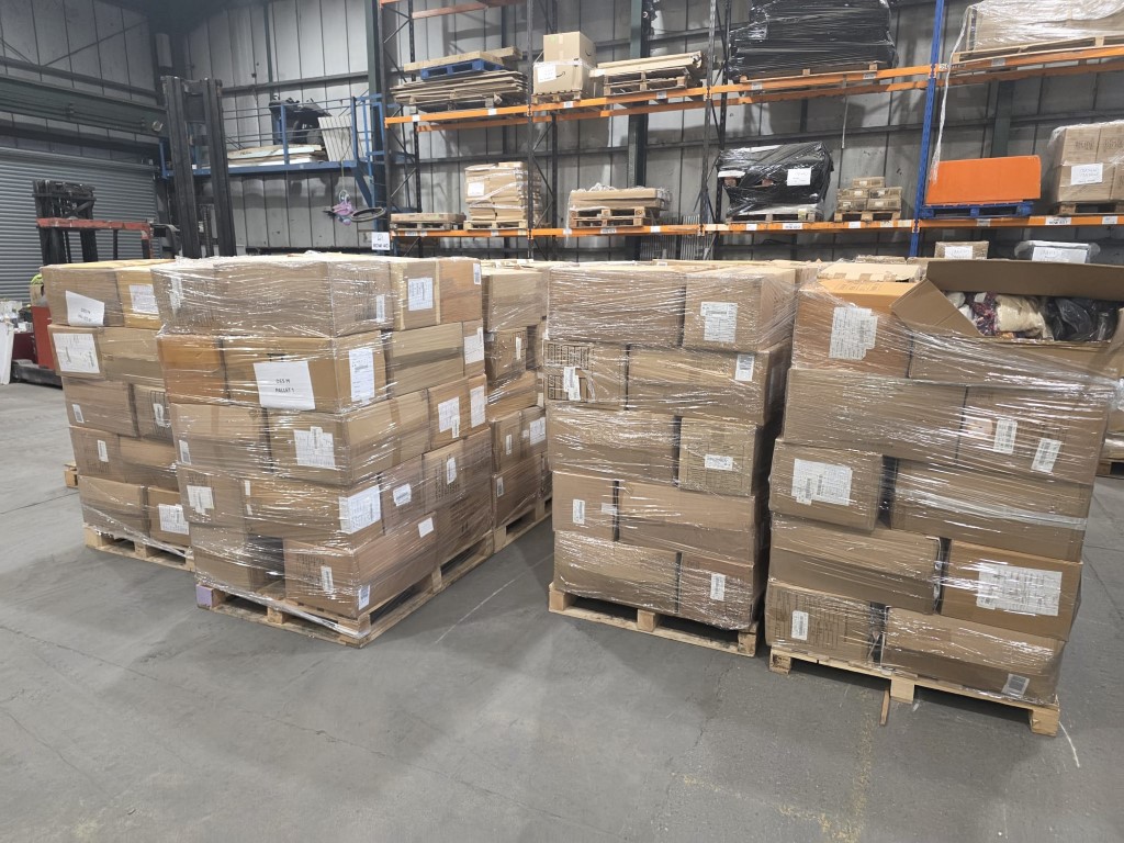 Bulk wholesale apparel pallets in warehouse ready for dispatch