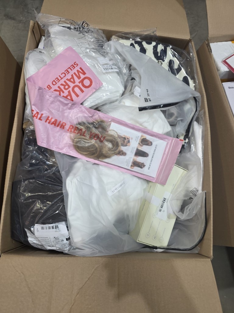 Warehouse shipping container holding small electrical appliances and compact home gear.