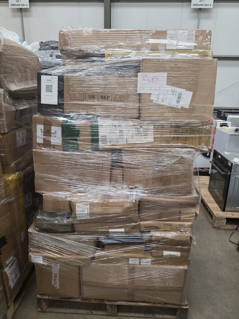 Wrapped bulk liquidation stock showing various Amazon return boxes